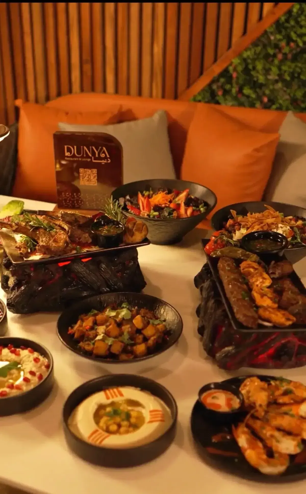 A DUNYA Levantine feast of grilled meats, mezze and sharing dishes on charcoal platters.